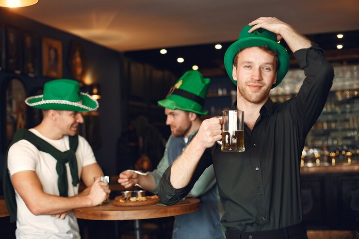 men in green hats friends celebrate st patrick s day celebration in a pub 1157 47014